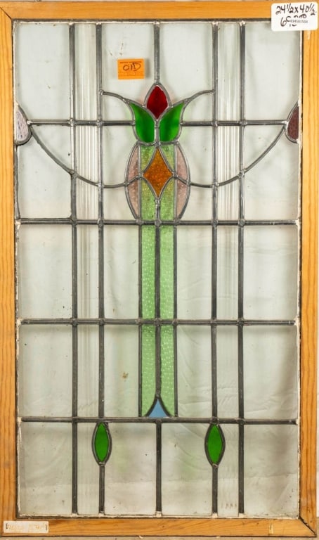 FRENCH ART NOUVEAU STAINED GLASS PANEL: French Art Nouveau stained glass panel with a floral medallion and multicolored glass accents. Approximate dimensions: h. 40.5", w. 24.5" Disclaimer: This is an online court ordered bankruptcy sale. P
