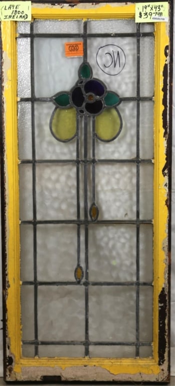 FRENCH ART NOUVEAU STAINED GLASS PANEL: French Art Nouveau stained glass panel with floral medallion and amber glass drops. Approximate dimensions: h. 43", w. 19" Disclaimer: This is an online court ordered bankruptcy sale. Participating bi