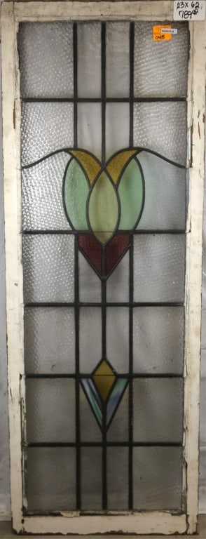 FRENCH ART NOUVEAU STAINED GLASS PANEL: French Art Nouveau stained glass panel with heart-shaped floral motif medallion and wispy glass accent. Approximate dimensions: h. 62", w. 23" Disclaimer: This is an online court ordered bankruptcy sa