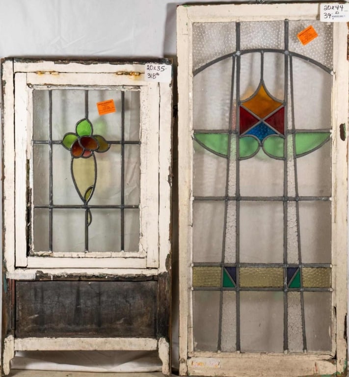 TWO CONTINENTAL STAINED GLASS PANELS: Two Continental stained glass panels with floral and geometric motifs. Approximate dimensions: h. 44", w. 20" Disclaimer: This is an online court ordered bankruptcy sale. Participating bidders must ha