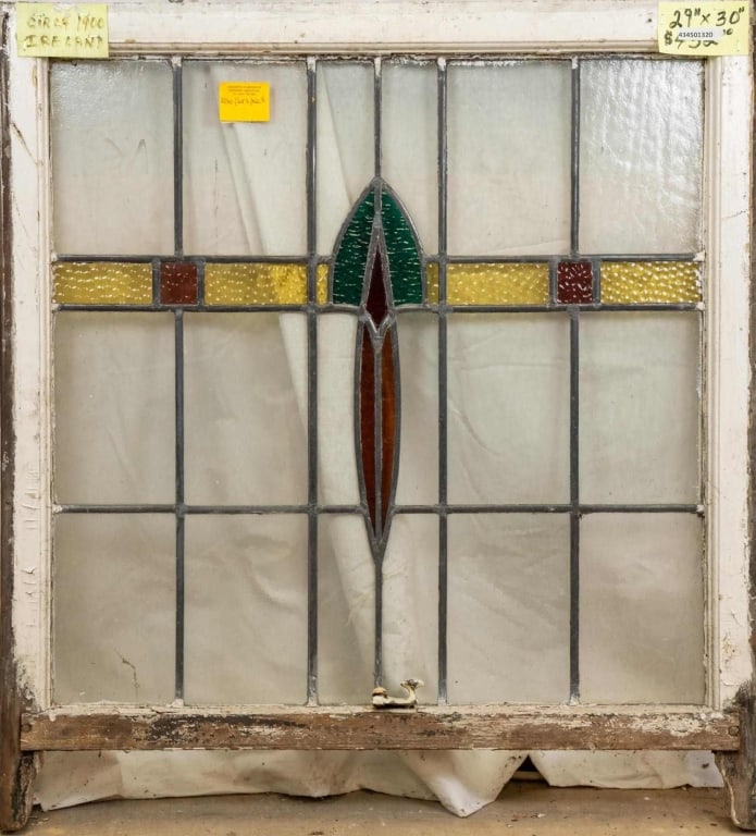 ANTIQUE IRISH STAINED GLASS PANEL: Antique Irish stained glass panel. Approximate dimensions: h. 30", w. 29" Disclaimer: This is an online court ordered bankruptcy sale. Participating bidders must have a credit card on file with Live A