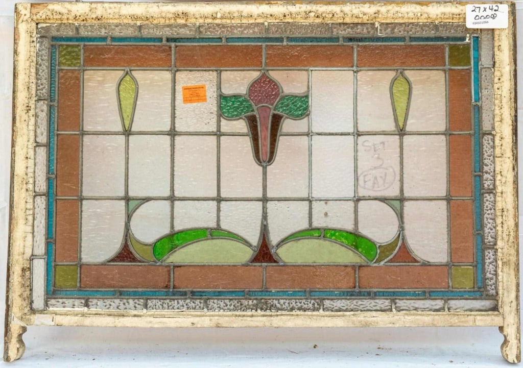 FRENCH ART NOUVEAU STAINED GLASS PANEL: French Art Nouveau stained glass panel with a central orchid stained glass medallion and leaf details. Approximate dimensions: h. 27", w. 42" Disclaimer: This is an online court ordered bankruptcy sal