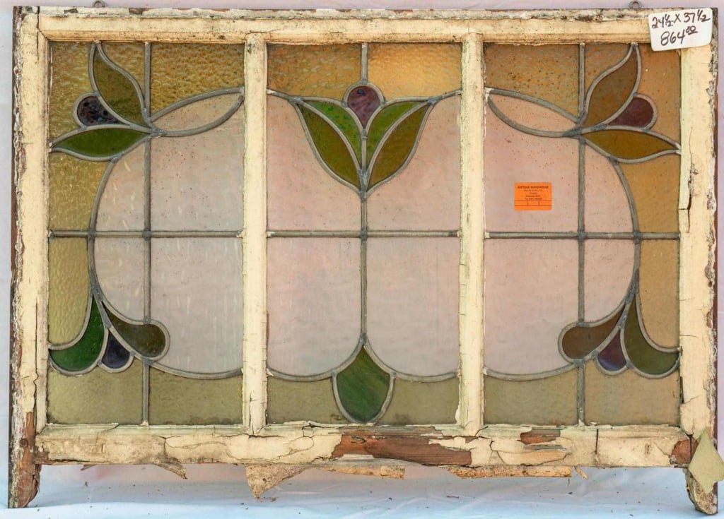 FRENCH ART NOUVEAU STAINED GLASS PANEL: French Art Nouveau stained glass panel with floral motifs set within leaded stained glass panels. Approximate dimensions: h. 24.5", w. 27.5" Disclaimer: This is an online court ordered bankruptcy sale