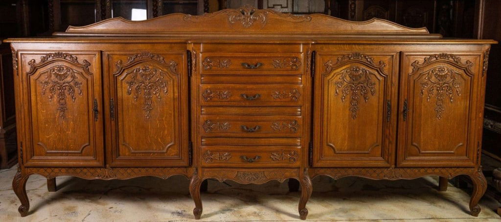 FRENCH OAK PARQUETRY TOP SIDEBOARD: French oak sideboard with cabriole legs, parquetry top, carved backsplash, carved apron, and inset carved panels. Approximate dimensions: h. 48", w. 106", d. 19.5" Disclaimer: This is an online court