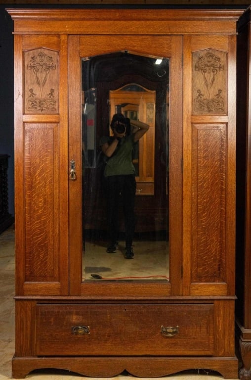 FRENCH ART NOUVEAU MIRRORED ARMOIRE: French Art Nouveau mirrored armoire with inset carved panels and beveled mirror. Approximate dimensions: h. 79.5", w. 51", d 20.25" Disclaimer: This is an online court ordered bankruptcy sale. Partici