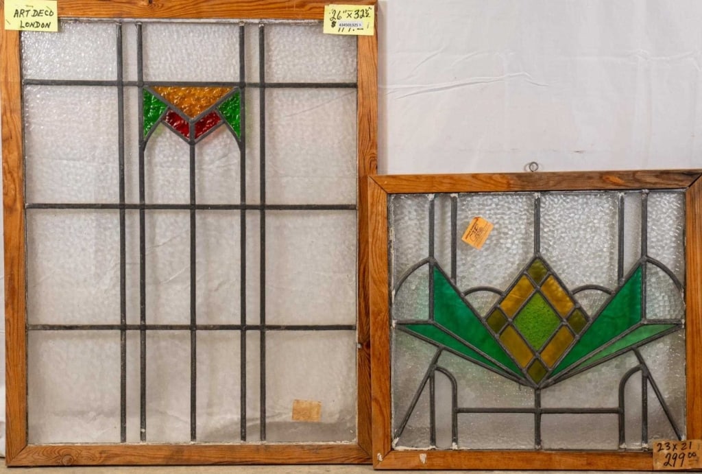 TWO CONTINENTAL STAINED GLASS PANELS: Two Continental stained glass panels with a geometric motif. Approximate dimensions: h. 32.5", w. 26" Disclaimer: This is an online court ordered bankruptcy sale. Participating bidders must have a cre