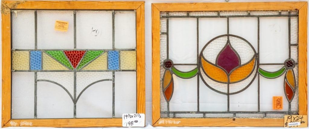 TWO FRENCH STAINED GLASS PANELS: Two French stained glass panels with textured stained glass accents and geometric and floral motifs. Approximate dimensions: h. 19", w. 24" Disclaimer: This is an online court ordered bankruptcy sale.