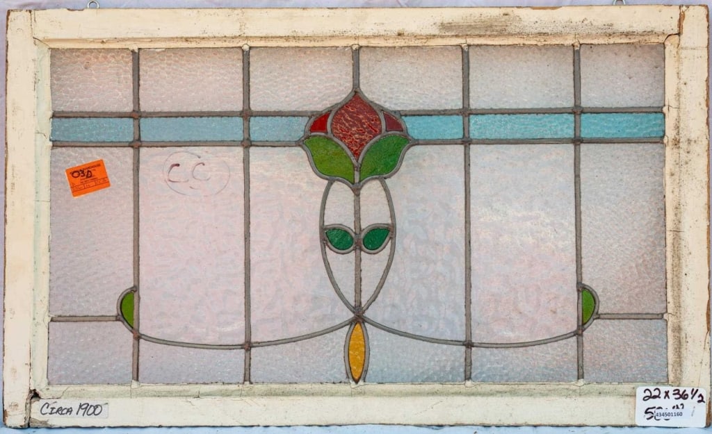 FRENCH ART NOUVEAU STAINED GLASS PANEL: French Art Nouveau stained glass panel with a floral motif. Approximate dimensions: h. 22", w. 36.5" Disclaimer: This is an online court ordered bankruptcy sale. Participating bidders must have a cred