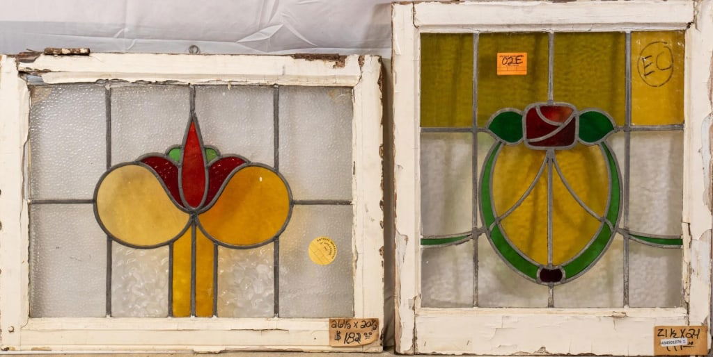 TWO ANTIQUE CONTINENTAL STAINED GLASS PANELS: Two antique Continental stained glass panels with floral medallions. Approximate dimensions: h. 24", w. 21.5" Disclaimer: This is an online court ordered bankruptcy sale. Participating bidders must ha