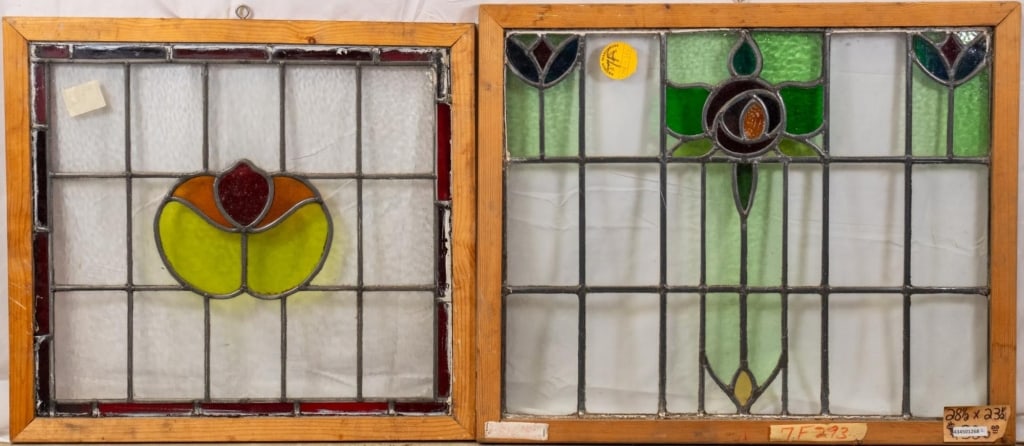 TWO CONTINENTAL STAINED GLASS PANELS: Two Continental stained glass panels with a floral motif. Approximate dimensions: h. 23.5", w. 28.5" Disclaimer: This is an online court ordered bankruptcy sale. Participating bidders must have a cred