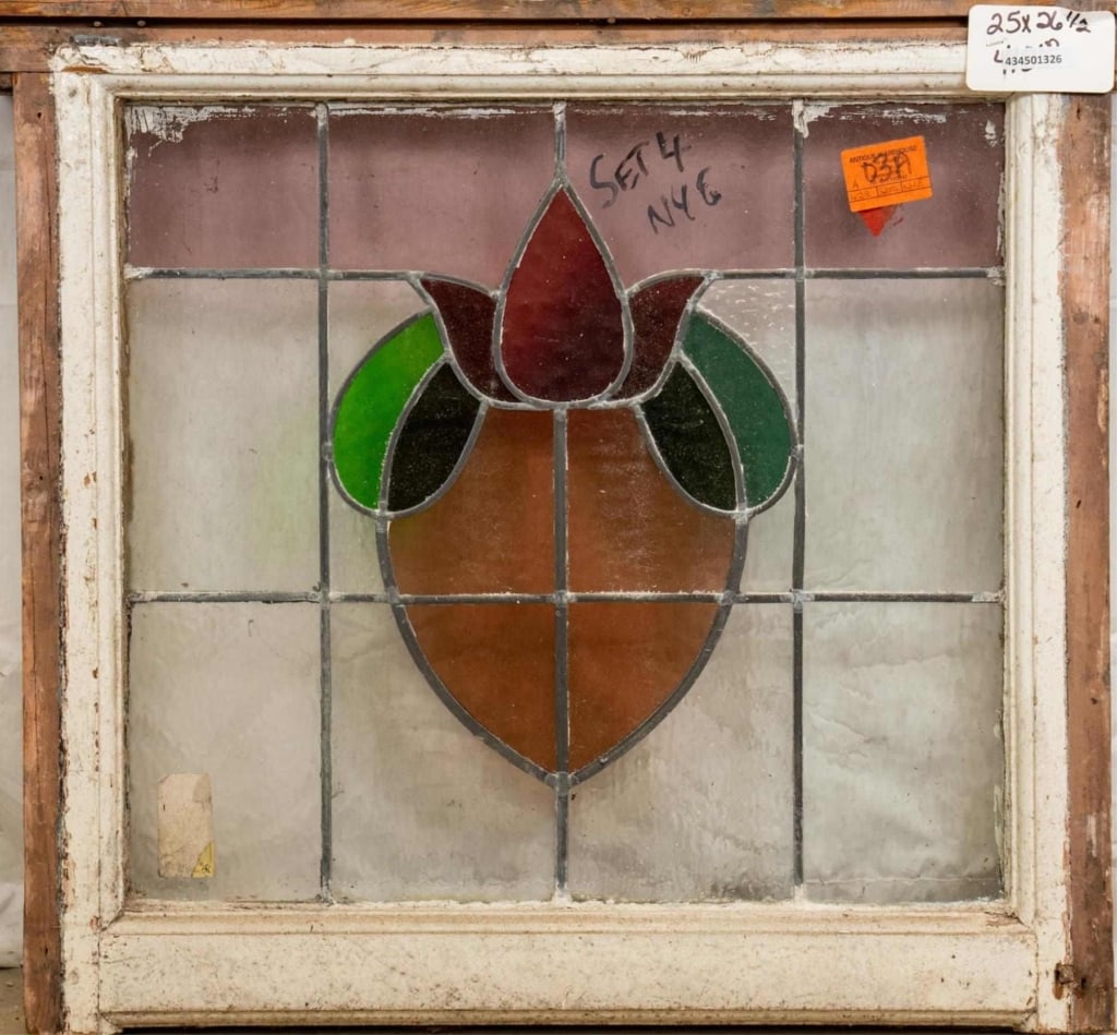 FRENCH ART NOUVEAU TRIPLE STAINED GLASS PANEL: French Art Nouveau triple stained glass panel with a heart-shaped floral medallion and pink-accented leaded glass details. Approximate dimensions: h. 26.5", w. 25" Disclaimer: This is an online court 