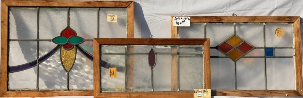 TWO CONTINENTAL STAINED GLASS PANELS: Two Continental stained glass panels with floral and geometric medallions. Approximate dimensions: h. 21", w. 20" Disclaimer: This is an online court ordered bankruptcy sale. Participating bidders mus