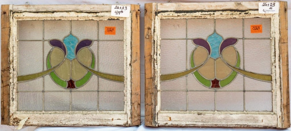 PAIR OF FRENCH ART NOUVEAU STAINED GLASS PANELS: Pair of French Art Nouveau stained glass panels composed of multicolored stained glass in a floral motif. Approximate dimensions: h. 23", w. 26" Disclaimer: This is an online court ordered bankruptcy