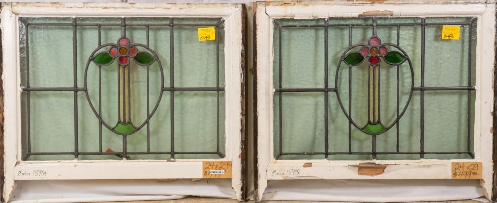 PAIR OF CONTINENTAL STAINED GLASS PANELS: Pair of Continental stained glass panels with heart-shaped floral motif medallions. Approximate dimensions: h. 24", w. 29" Disclaimer: This is an online court ordered bankruptcy sale. Participating bi