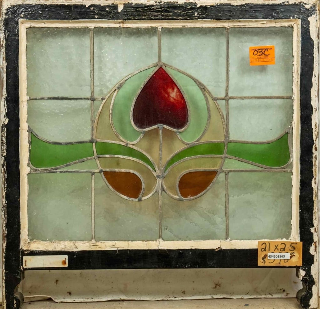 FRENCH ART NOUVEAU STAINED GLASS PANEL: French Art Nouveau stained glass panel with heart-shaped medallion and floral motif. Approximate dimensions: h. 21", w. 25" Disclaimer: This is an online court ordered bankruptcy sale. Participating b