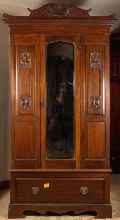FRENCH ART NOUVEAU MAHOGANY ARMOIRE: French Art Nouveau mahogany armoire with arch pediment, beveled mirror, and inset carved panels. Approximate dimensions: h. 85", w. 47", d. 20" Disclaimer: This is an online court ordered bankruptcy s