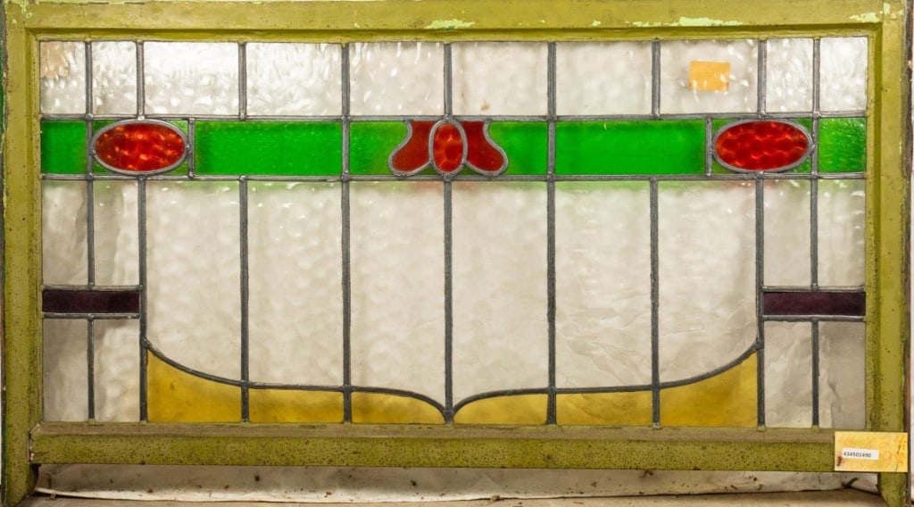 CONTINENTAL STAINED GLASS PANEL: Continental stained glass panel, showcasing multicolored stained glass elements. Approximate dimensions: h. 24", w. 46" Disclaimer: This is an online court ordered bankruptcy sale. Participating bidde