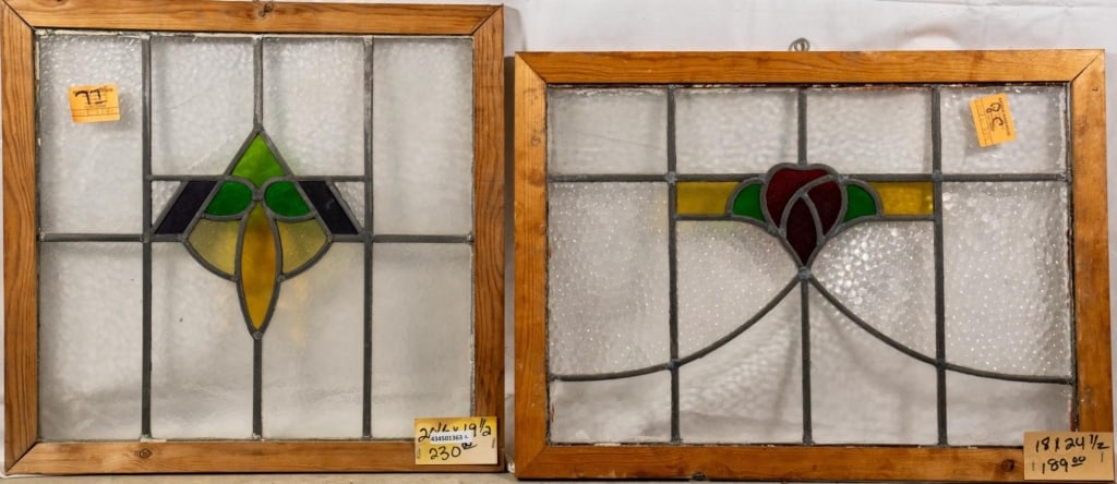 TWO CONTINENTAL STAINED GLASS PANELS: Two Continental stained glass panels with floral and geometric motifs. Approximate dimensions: h. 18", w. 24.5" Disclaimer: This is an online court ordered bankruptcy sale. Participating bidders must