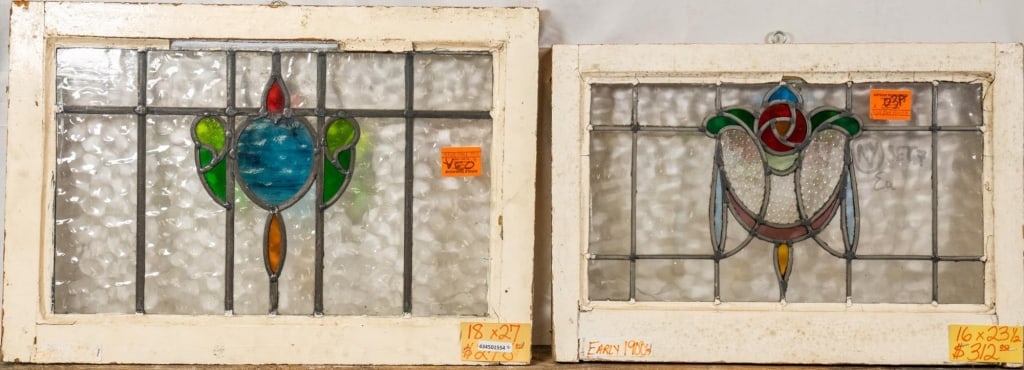 TWO FRENCH ART NOUVEAU GLASS PANELS: Two French Art Nouveau glass panels, one with a floral motif and blue wispy glass medallion, the other with a rose and leaf medallion with garland motif. Approximate dimensions: h. 18", w. 27" Disclai