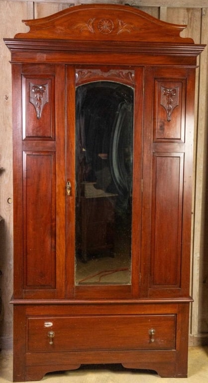 FRENCH ART NOUVEAU ARMOIRE: French Art Nouveau armoire with beveled mirror, carved rosette, inset carved panels, and brass teardrop pulls. Approximate dimensions: h. 87", w. 45", d. 19" Disclaimer: This is an online court ordere