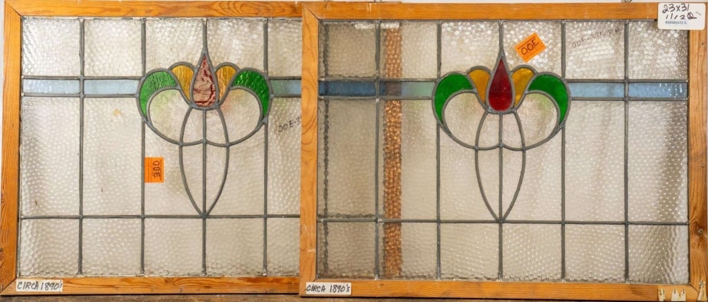 PAIR OF FRENCH ART NOUVEAU STAINED GLASS PANELS: Pair of French Art Nouveau stained glass panels with floral medallion and colorless and blue leaded glass panels. Approximate dimensions: h. 23", w. 31" Disclaimer: This is an online court ordered ban