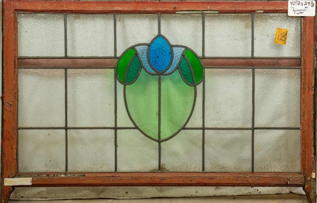 FRENCH ART NOUVEAU STAINED GLASS PANEL: French Art Nouveau stained glass panel with floral medallion and colorless and purple leaded glass panels. Approximate dimensions: h. 24.5", w. 40.5" Disclaimer: This is an online court ordered bankru