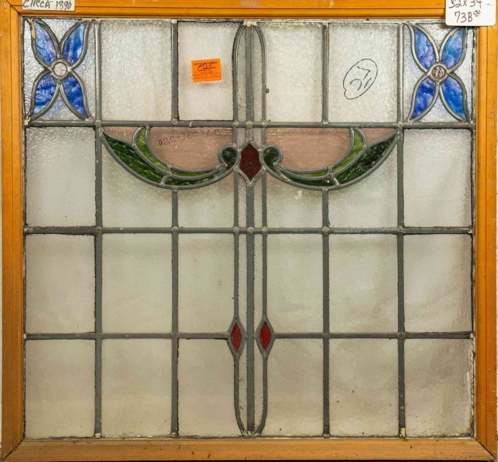 FRENCH ART NOUVEAU STAINED GLASS PANEL: French Art Nouveau stained glass panel with floral motif and blue flower accents. Approximate dimensions: h. 32", w. 34" Disclaimer: This is an online court ordered bankruptcy sale. Participating bidd
