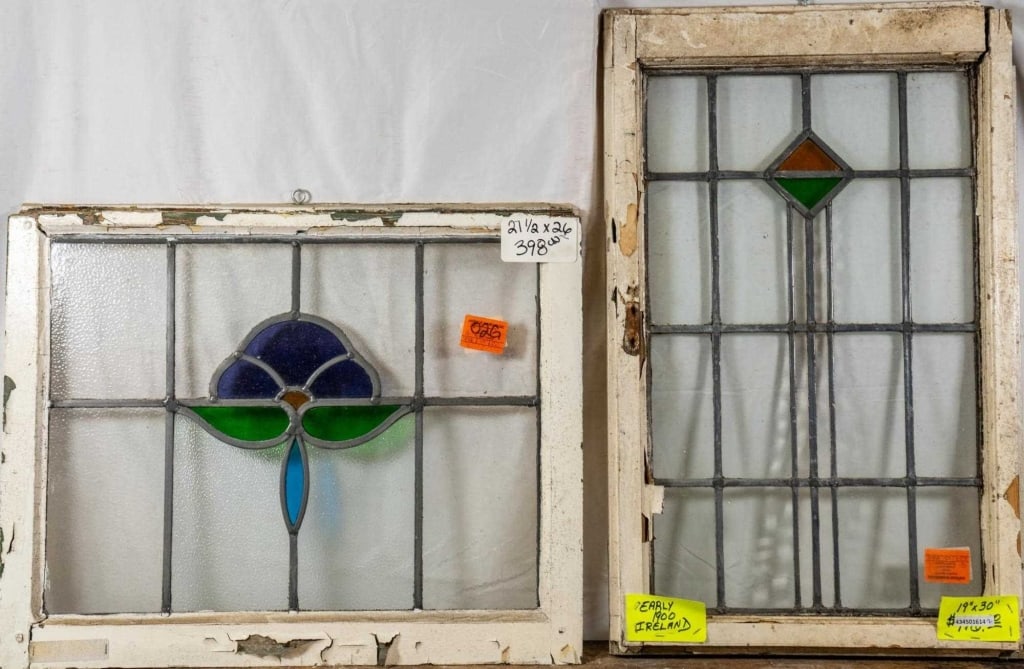 TWO CONTINENTAL STAINED GLASS PANELS: Two Continental stained glass panels. Approximate dimensions: h. 26", w. 27.5" Disclaimer: This is an online court ordered bankruptcy sale. Participating bidders must have a credit card on file with L