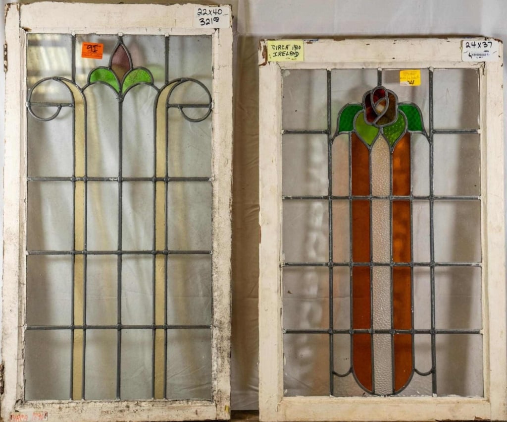 TWO CONTINENTAL STAINED GLASS PANELS: Two Continental stained glass panels with floral motif. Approximate dimensions: h. 40", w. 22" Disclaimer: This is an online court ordered bankruptcy sale. Participating bidders must have a credit car