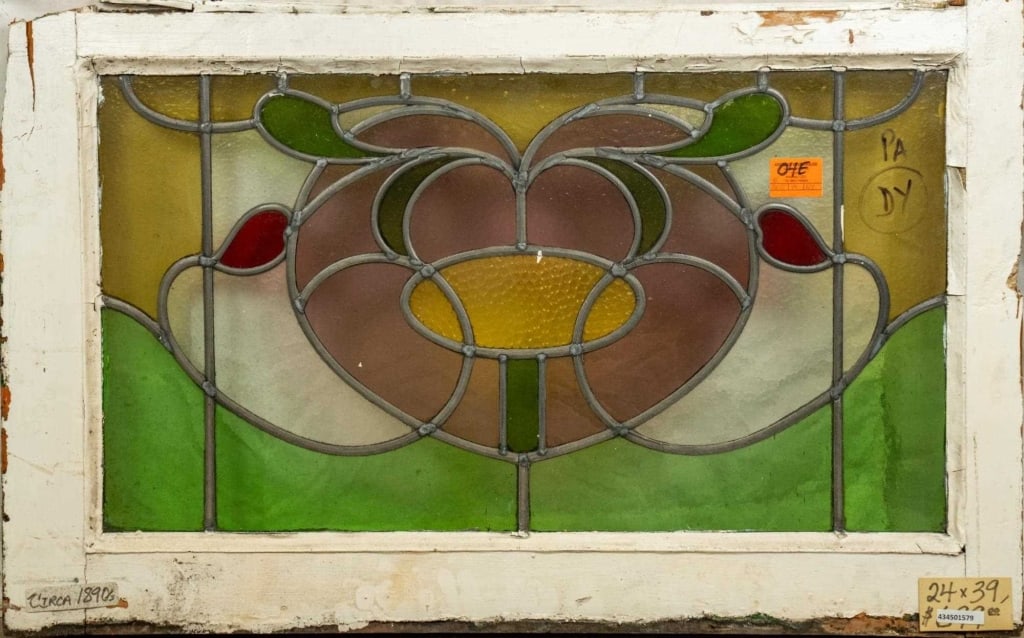 FRENCH ART NOUVEAU STAINED GLASS PANEL: French Art Nouveau stained glass panel with heart-shaped medallion and floral details. Approximate dimensions: h. 24", w. 39" Disclaimer: This is an online court ordered bankruptcy sale. Participating