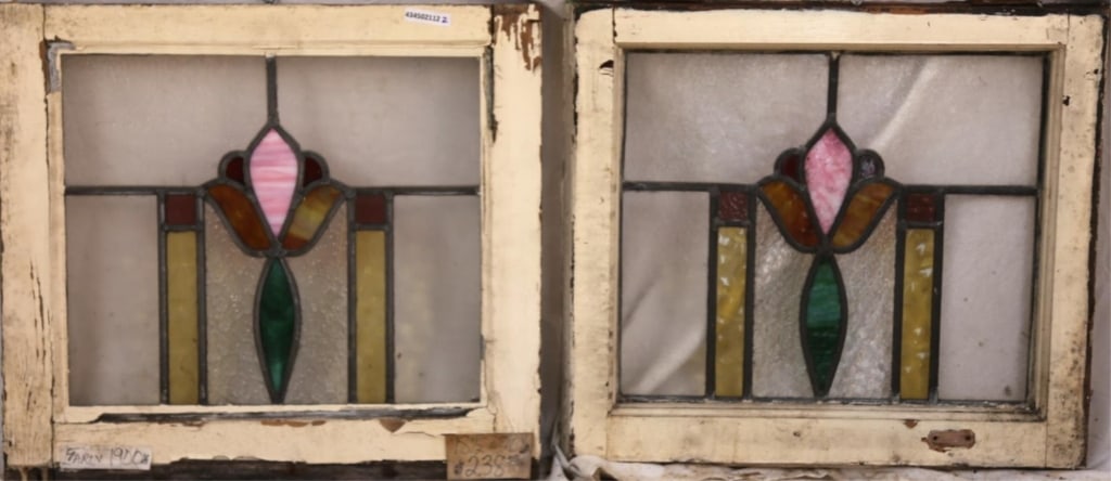 PAIR OF FRENCH ART NOUVEAU STAINED GLASS PANELS: Pair of French Art Nouveau stained glass panels with floral medallions, amber and purple accents, and amber wispy glass detail. Approximate dimensions: h. 18.5", w. 20" Disclaimer: This is an online c