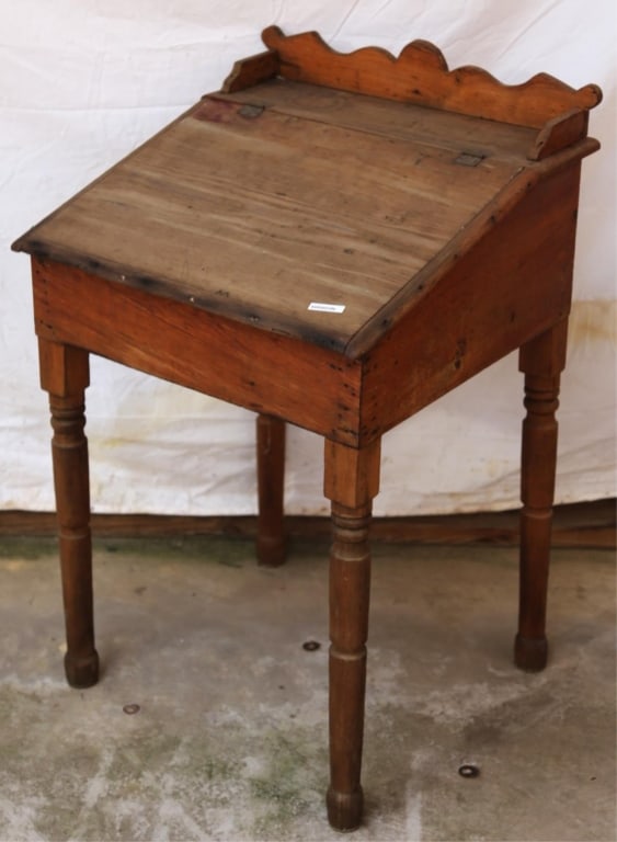 AMERICAN PRIMITIVE SLANT-FRONT DESK: American Primitive slant-front desk with carved legs and gallery. Approximate dimensions: h. 36", w. 23", d. 21.25" Disclaimer: This is an online court ordered bankruptcy sale. Participating bidders m