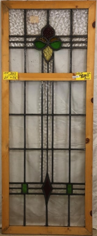 ANTIQUE ENGLISH STAINED GLASS PANEL: Antique English stained glass panel with textured red petal element and floral medallion. Approximate dimensions: h. 56", w. 22" Disclaimer: This is an online court ordered bankruptcy sale. Participat