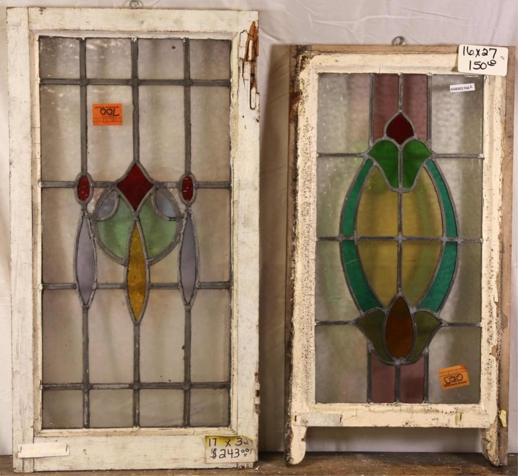 TWO ANTIQUE CONTINENTAL STAINED GLASS PANELS: Two antique Continental stained glass panels with multicolored floral and abstract elements. Approximate dimensions: h. 32", w. 17" Disclaimer: This is an online court ordered bankruptcy sale. Partici