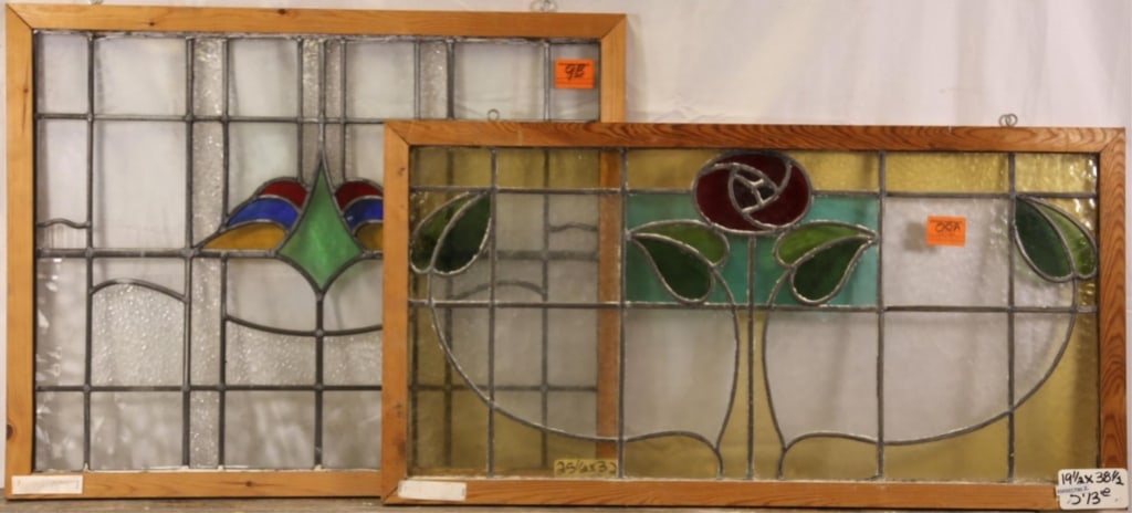 TWO ANTIQUE CONTINENTAL STAINED GLASS PANELS: Two antique Continental stained glass panels, one with rose medallions and the other with abstract multicolored medallion. Approximate dimensions: h. 19.5", w. 38" Disclaimer: This is an online court