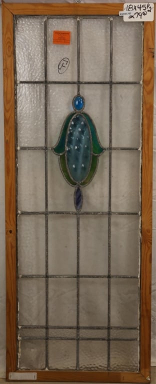 ANTIQUE CONTINENTAL STAINED GLASS PANEL: Antique Continental stained glass panel with blue jeweled detail and wispy glass dark blue detail on the medallion. Approximate dimensions: h. 45.5", w. 18" Disclaimer: This is an online court ordered