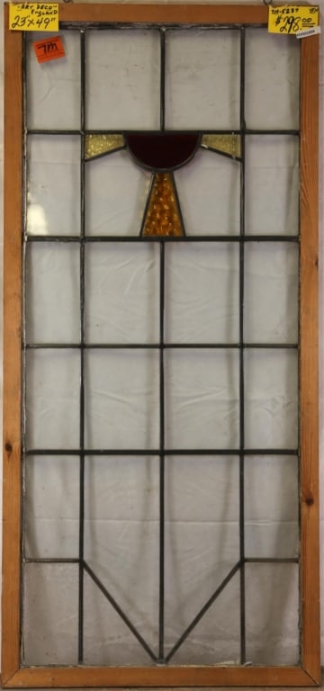 ENGLISH ART DECO STAINED GLASS PANEL: English Art Deco stained glass panel with textured amber and canary yellow accents and dark red half-sphere. Approximate dimensions: h. 49", w. 23" Disclaimer: This is an online court ordered bankrupt