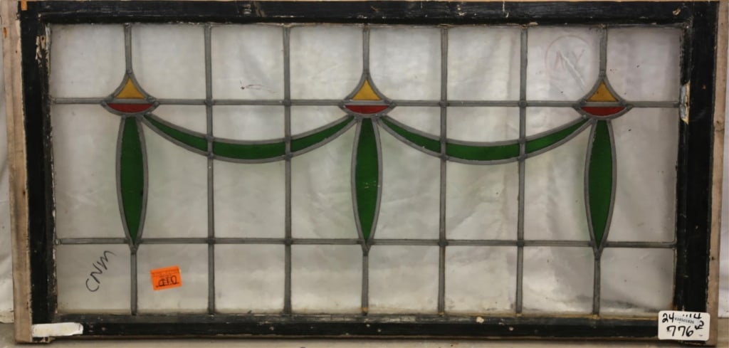 CONTINENTAL ART NOUVEAU STAINED GLASS PANEL: Continental Art Nouveau stained glass panel with botanical ribbon motif and yellow and red floral elements. Approximate dimensions: h. 24", w. 44.5" Disclaimer: This is an online court ordered bankrup