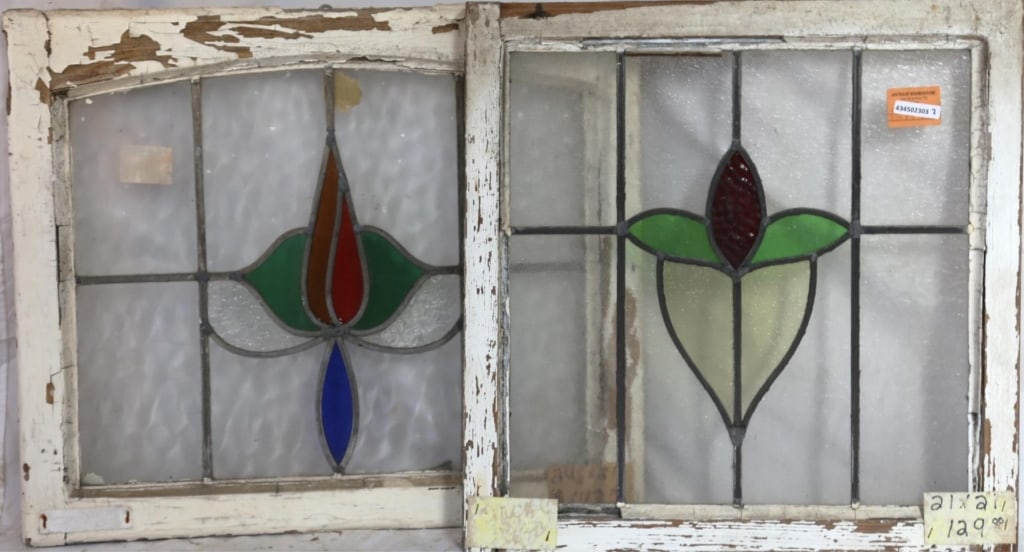 TWO CONTINENTAL STAINED GLASS PANELS: Two Continental stained glass panels with multicolored stained glass medallions. Approximate dimensions: h. 21", w. 24.5" Disclaimer: This is an online court ordered bankruptcy sale. Participating bid
