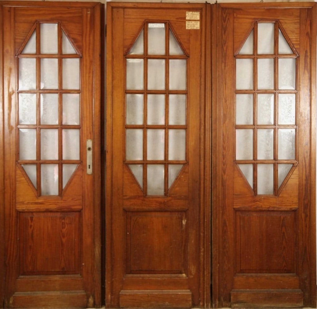DUTCH ETCHED GLASS DOOR: Dutch etched glass door with etched and beveled floral motif panels in oak. Approximate dimensions: each: h. 79", w. 29" Disclaimer: This is an online court ordered bankruptcy sale. Participating bidd