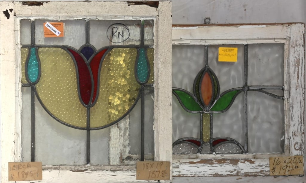 TWO CONTINENTAL STAINED GLASS PANELS: Two Continental stained glass panels with multicolored stained glass accents. Approximate dimensions: h. 19", w. 18" Disclaimer: This is an online court ordered bankruptcy sale. Participating bidders