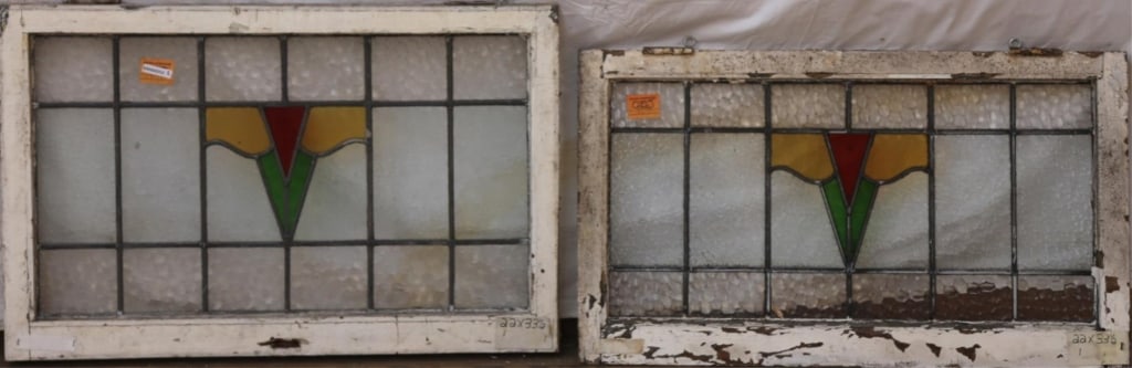 TWO ENGLISH STAINED GLASS PANELS: Two English stained glass panels with multicolored stained glass medallions. Approximate dimensions: h. 22", w. 23.5" Disclaimer: This is an online court ordered bankruptcy sale. Participating bidders