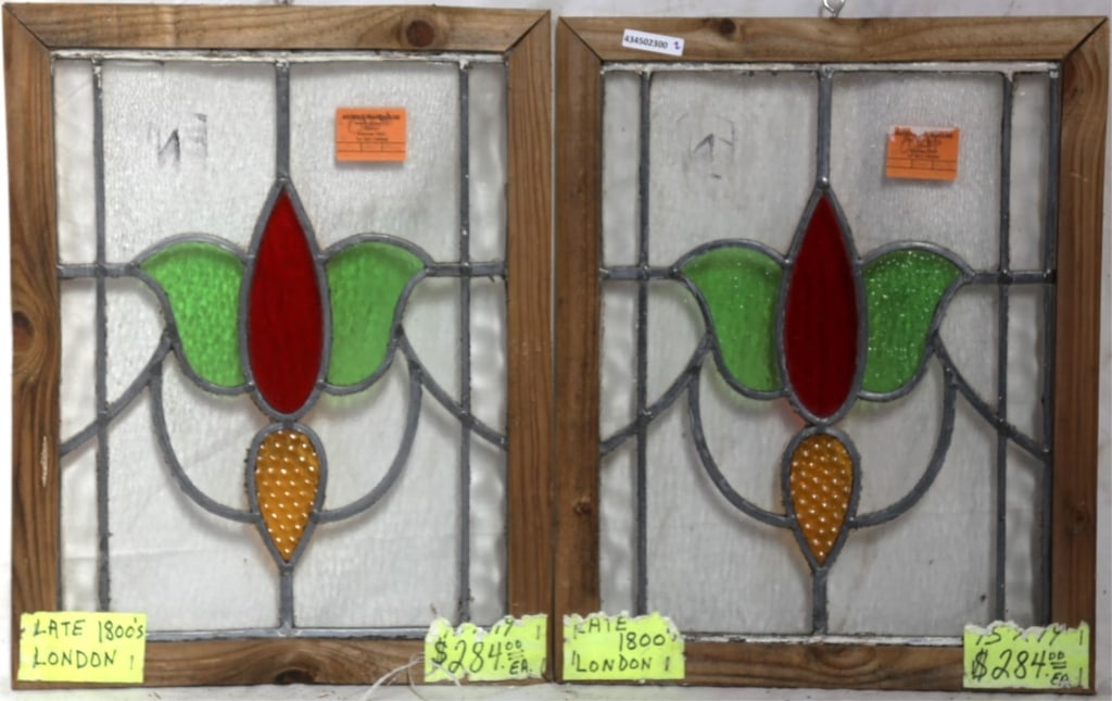 PAIR OF ENGLISH STAINED GLASS PANELS: Pair of English stained glass panels with a floral motif. Approximate dimensions: h. 19", w. 15" Disclaimer: This is an online court ordered bankruptcy sale. Participating bidders must have a credit c