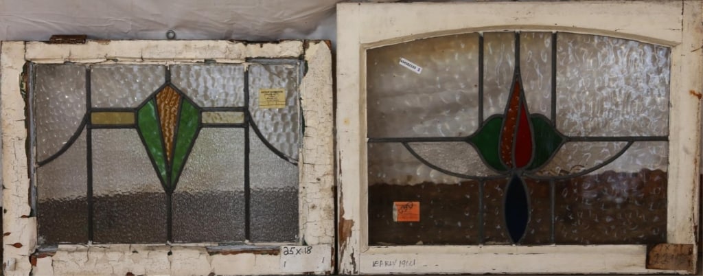 TWO ANTIQUE CONTINENTAL STAINED GLASS PANELS: Two antique Continental stained glass panels with floral and geometric medallions and multicolored stained glass accents. Approximate dimensions: h. 21", w. 27" Disclaimer: This is an online court ord