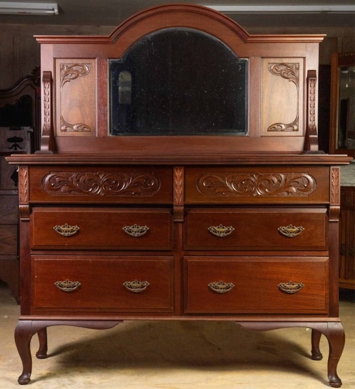 FRENCH ART NOUVEAU MAHOGANY DRESSER: French Art Nouveau mahogany dresser with beveled mirror, inset carved panels, and brass pulls. Approximate dimensions: h. 65", w. 55", d. 20" Disclaimer: This is an online court ordered bankruptcy sal
