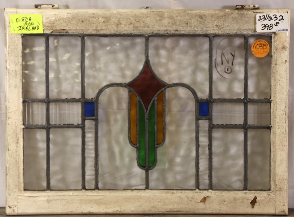 IRISH ART DECO STAINED GLASS PANEL: Irish Art Deco stained glass panel with multicolored geometric medallion. Approximate dimensions: h. 23.5", w. 32" Disclaimer: This is an online court ordered bankruptcy sale. Participating bidders mu