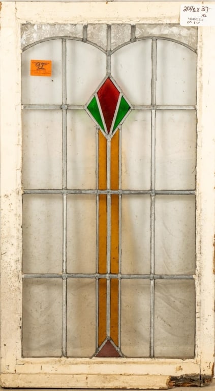 FRENCH ART DECO STAINED GLASS PANEL: French Art Deco stained glass panel with a red and green rhombic medallion. Approximate dimensions: h. 27", w. 20.5" Disclaimer: This is an online court ordered bankruptcy sale. Participating bidders