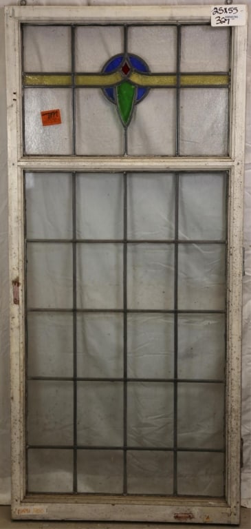 ENGLISH ART DECO STAINED GLASS PANEL: English Art Deco stained glass panel with blue, canary, red, and green medallion. Approximate dimensions: h. 55", w. 25" Disclaimer: This is an online court ordered bankruptcy sale. Participating bidd