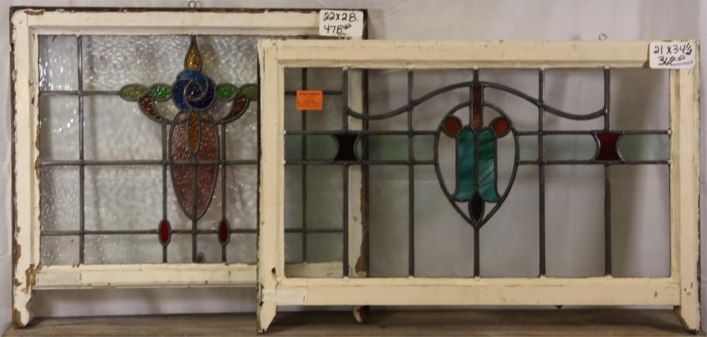 TWO FRENCH ART NOUVEAU STAINED GLASS PANELS: Two French Art Nouveau stained glass panels with floral medallions and textured and wispy glass accents. Approximate dimensions: h. 21", w. 34.5" Disclaimer: This is an online court ordered bankruptcy