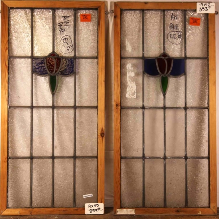 PAIR OF CONTINENTAL ART NOUVEAU STAINED GLASS PANE: Pair of Continental Art Nouveau stained glass panels with floral motif. Approximate dimensions: h. 40", w. 19" Disclaimer: This is an online court ordered bankruptcy sale. Participating bidders must h